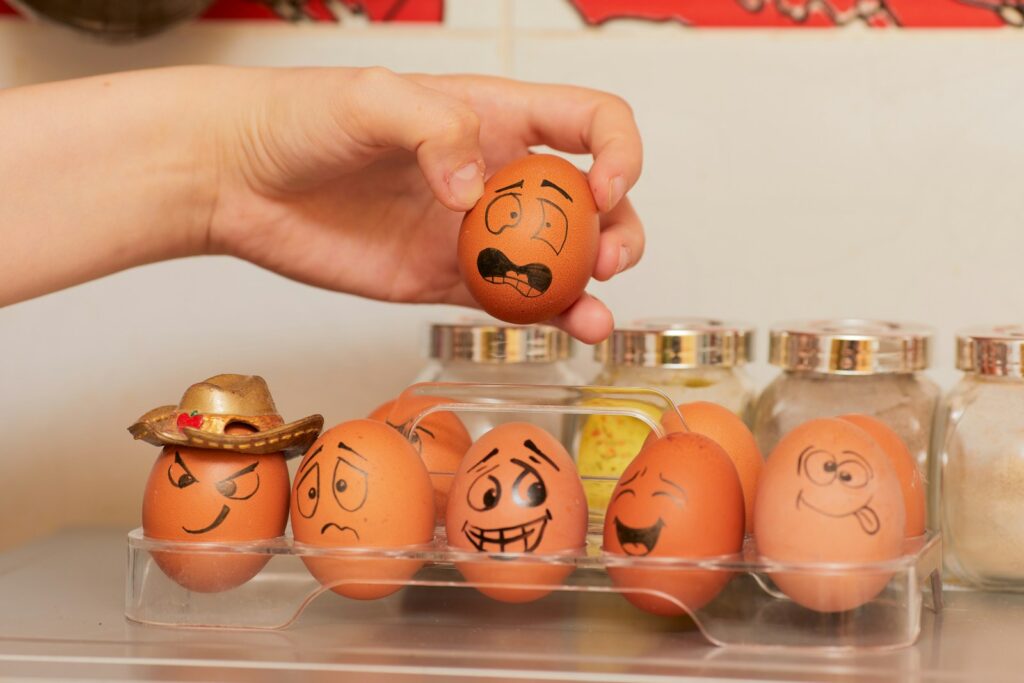 orange and white eggs with cartoon faces